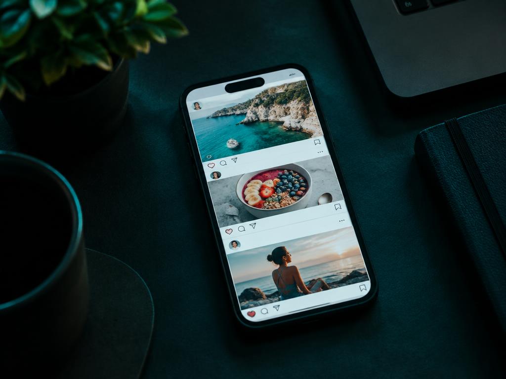 Phone showing a social media feed